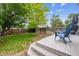 Relaxing backyard deck with lush lawn and a privacy fence at 9316 Harrison St, Thornton, CO 80229