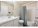 Beautiful bathroom featuring white vanity, modern fixtures and shower-tub combo at 9316 Harrison St, Thornton, CO 80229