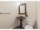 This bathroom offers a modern sink with stylish fixtures and lighting at 9316 Harrison St, Thornton, CO 80229
