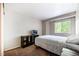 The bedroom features a tv, natural light, and carpet at 9316 Harrison St, Thornton, CO 80229