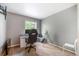 Bedroom featuring a desk, monitor, and comfy chair at 9316 Harrison St, Thornton, CO 80229