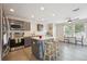 Modern kitchen featuring stainless steel appliances, stylish island, and sleek cabinetry at 9316 Harrison St, Thornton, CO 80229