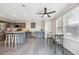 Well-lit kitchen features a large island with seating, modern appliances, and ample natural light at 9316 Harrison St, Thornton, CO 80229