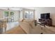 Bright living room area and dining nook with seamless transition to the modern kitchen at 9316 Harrison St, Thornton, CO 80229