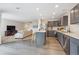 Spacious open concept featuring the kitchen, living room and staircase at 9316 Harrison St, Thornton, CO 80229