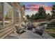 Exterior view of backyard patio area with firepit and comfortable seating at 18647 E Berry Dr, Aurora, CO 80015