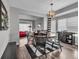 Charming dining room with a round table and elegant lighting, perfect for Gathering meals at 18647 E Berry Dr, Aurora, CO 80015