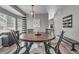 Elegant dining room with a round table and stylish decor, perfect for gatherings at 18647 E Berry Dr, Aurora, CO 80015
