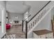 Elegant entryway with hardwood floors and a staircase, creating a grand entrance to the home at 18647 E Berry Dr, Aurora, CO 80015