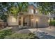 Charming two-story home featuring a well-manicured lawn and a welcoming front porch at 18647 E Berry Dr, Aurora, CO 80015