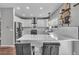 Bright kitchen features white cabinets, stainless steel appliances, and a large center island at 18647 E Berry Dr, Aurora, CO 80015