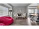 Cozy living room with comfortable seating, a fireplace, and stylish decor at 18647 E Berry Dr, Aurora, CO 80015