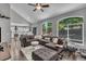 Open floorplan living room with cathedral ceilings and views of the kitchen and backyard at 18647 E Berry Dr, Aurora, CO 80015