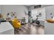 Home office features a desk, chair, and exercise bike at 18647 E Berry Dr, Aurora, CO 80015