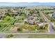Beautiful neighborhood features mature trees, spacious homes, a basketball court and white fencing at 2466 Spruce Meadows Dr, Broomfield, CO 80023