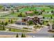 Aerial view of a beautiful home with a three-car garage and manicured landscaping, nestled in a green neighborhood at 2466 Spruce Meadows Dr, Broomfield, CO 80023