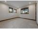 Unfurnished basement featuring natural light from large windows at 2466 Spruce Meadows Dr, Broomfield, CO 80023