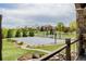 Private basketball court next to the home, landscaped with trees and greenery, offering a fun recreational space at 2466 Spruce Meadows Dr, Broomfield, CO 80023