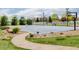 Full-size basketball court features manicured landscaping, a net, and a paved pathway leading to it at 2466 Spruce Meadows Dr, Broomfield, CO 80023