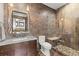 Elegant bathroom featuring a modern vanity, decorative mirror, and stylish tiled shower with a built-in bench at 2466 Spruce Meadows Dr, Broomfield, CO 80023