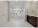 Bright bathroom with a freestanding tub, glass-enclosed shower, and elegant fixtures at 2466 Spruce Meadows Dr, Broomfield, CO 80023