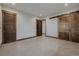 Large room featuring unique sliding barn doors with rustic trim and finishes at 2466 Spruce Meadows Dr, Broomfield, CO 80023