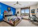 Spacious bedroom with a large window offering great views, a ceiling fan, and colorful decor at 2466 Spruce Meadows Dr, Broomfield, CO 80023