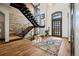 Stunning foyer with hardwood floors, modern staircase, and abundant natural light at 2466 Spruce Meadows Dr, Broomfield, CO 80023