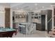 Contemporary kitchen with granite countertops, sleek cabinetry, and island seating at 2466 Spruce Meadows Dr, Broomfield, CO 80023