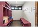 Spacious mudroom with built-in storage cubbies, bench seating, and durable tile flooring at 2466 Spruce Meadows Dr, Broomfield, CO 80023