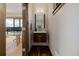 Modern powder room featuring floating vanity, wood accents, and stylish lighting at 2466 Spruce Meadows Dr, Broomfield, CO 80023