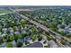 Gorgeous aerial view of the property highlighting its location, landscaping and mature trees at 601 E 131St Ct, Thornton, CO 80241