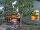 Backyard view of the home's deck with ambient lighting and outdoor kitchen area at 601 E 131St Ct, Thornton, CO 80241