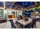 Outdoor deck with pergola, lighting, seating, and a glimpse into the adjacent kitchen at 601 E 131St Ct, Thornton, CO 80241
