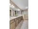 Spa-like bathroom with double sinks, tiled shower, and neutral tones, creating a relaxing retreat at 601 E 131St Ct, Thornton, CO 80241