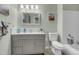 Well-lit bathroom with a modern vanity, toilet, and bathtub, offering a functional and clean space at 601 E 131St Ct, Thornton, CO 80241