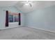 Bright bedroom with large window and neutral carpet, offering a serene and comfortable space at 601 E 131St Ct, Thornton, CO 80241