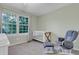 Cozy Bedroom with a crib, glider chair, and large window for a peaceful environment at 601 E 131St Ct, Thornton, CO 80241