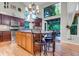 Bright kitchen with a central island, stainless steel appliances, and deck access at 601 E 131St Ct, Thornton, CO 80241