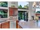 Kitchen with stainless steel appliances, granite countertops, and backyard access at 601 E 131St Ct, Thornton, CO 80241