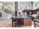 Open-concept kitchen with large island and stainless steel appliances at 601 E 131St Ct, Thornton, CO 80241