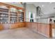 Bright living space showcasing a custom bookshelf, tall ceilings, and a large window for natural light at 601 E 131St Ct, Thornton, CO 80241