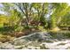 Picturesque backyard with a pond, a fountain and deck at 3935 Pierson St, Wheat Ridge, CO 80033