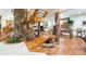 Unique basement with rock features, a bridge, brick columns, and entertainment area with tile flooring at 3935 Pierson St, Wheat Ridge, CO 80033