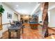 Entertaining basement with a fireplace, pool table, foosball table, sitting area and brick column at 3935 Pierson St, Wheat Ridge, CO 80033