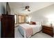 Cozy bedroom with bay window, ceiling fan, plush bedding and ample natural light at 3935 Pierson St, Wheat Ridge, CO 80033