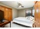 Cozy bedroom with carpet, ceiling fan, closet, and window with blinds at 3935 Pierson St, Wheat Ridge, CO 80033