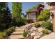 Beautifully landscaped front entrance with stone steps and a well-maintained garden at 3935 Pierson St, Wheat Ridge, CO 80033