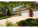 Two-story home with a two-car garage and landscaped front yard at 3935 Pierson St, Wheat Ridge, CO 80033