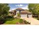 Beautiful two-story home with a well-manicured lawn, mature trees, and a two-car garage at 3935 Pierson St, Wheat Ridge, CO 80033